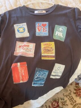 Anthropologie Black Graphic Tee with Red & Blue Accents